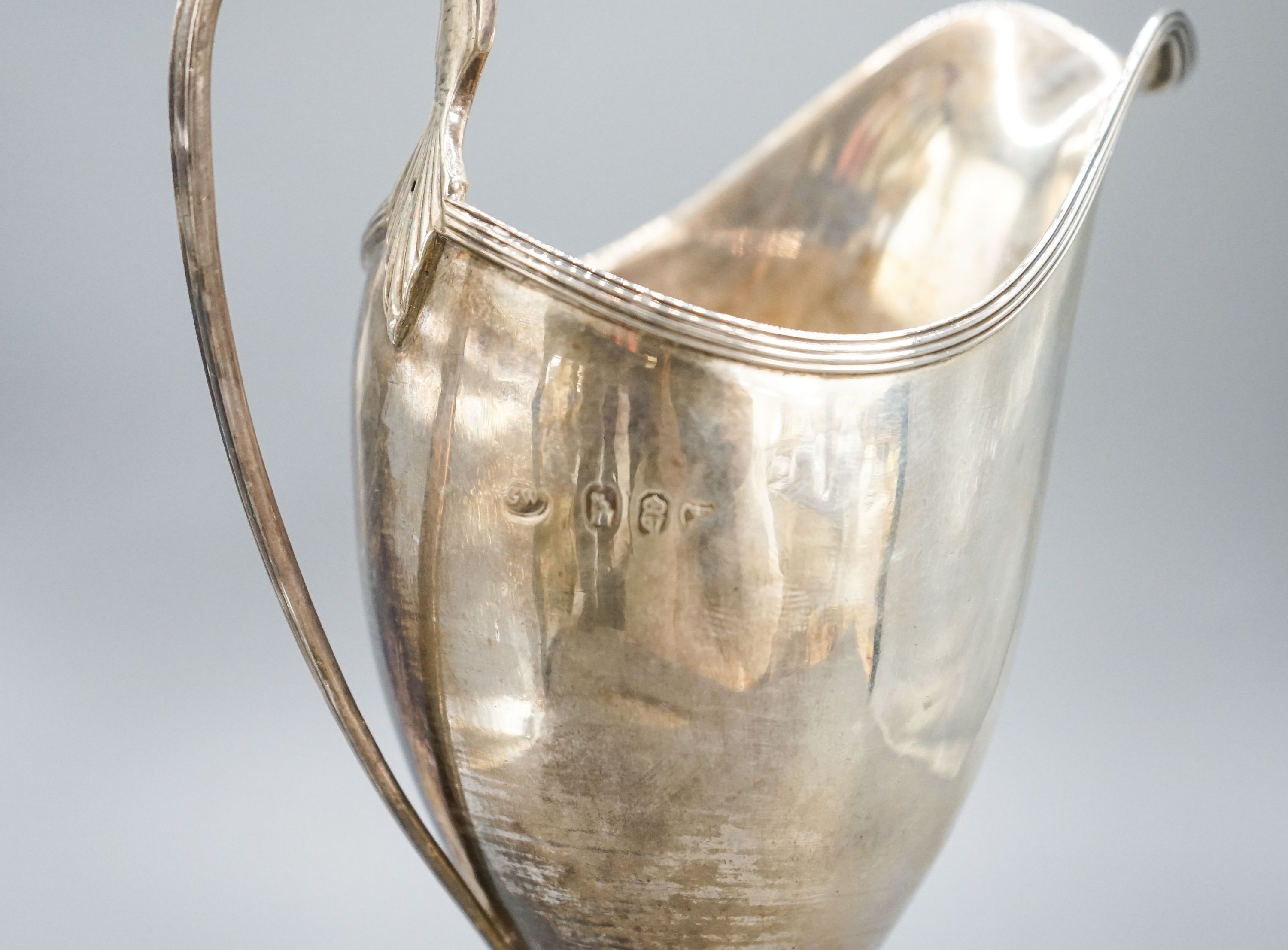 A George III Irish silver pedestal cream jug, George West, Dublin, 1794, 18cm, 7oz.